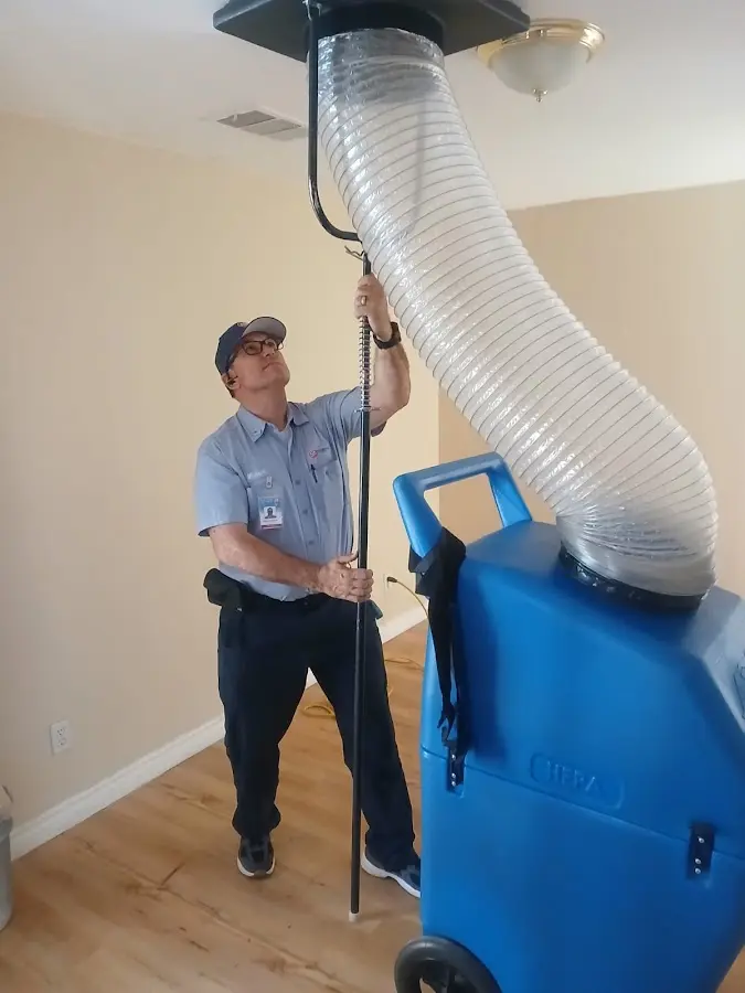 Furnace Tune-Up technician using HEPA equipment in Salt Lake City